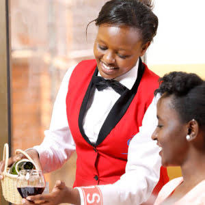 ihti student serving wine to a diner jpg