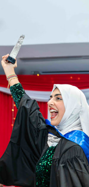 ihti student receiving an award during graduation jpg