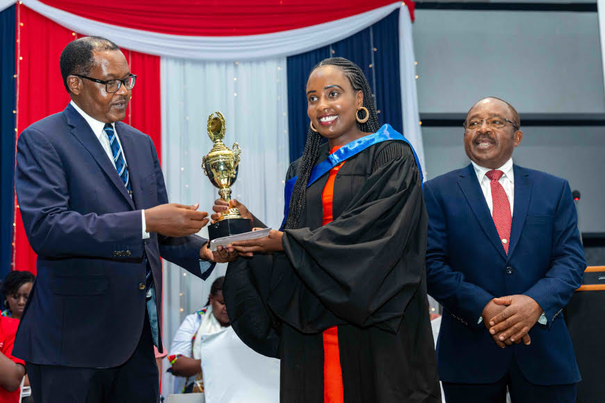 a ihti graduand being awarded a trophy jpg