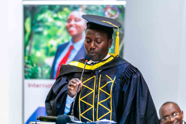 a ihti instructor delivering a speech during graduation ceremony jpg