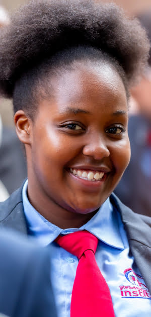 ihti student in official attire smiling jpg