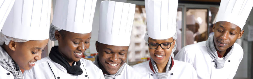 ihti students in kitche attire posing for a photo jpg