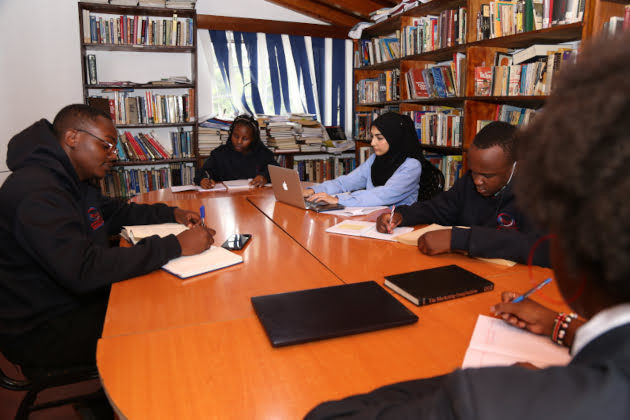 ihti students in a library jpg