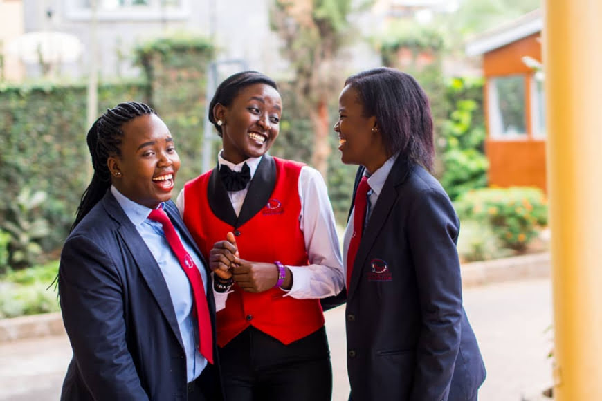 three ihti students in a hearty laughter moment at the institute jpg