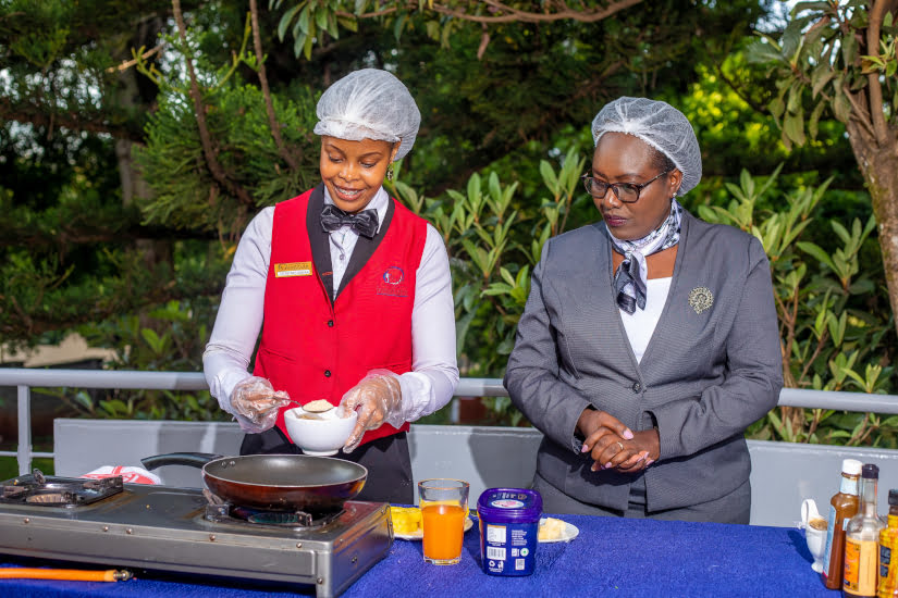 Student cooking under teacher supervision ihti jpg